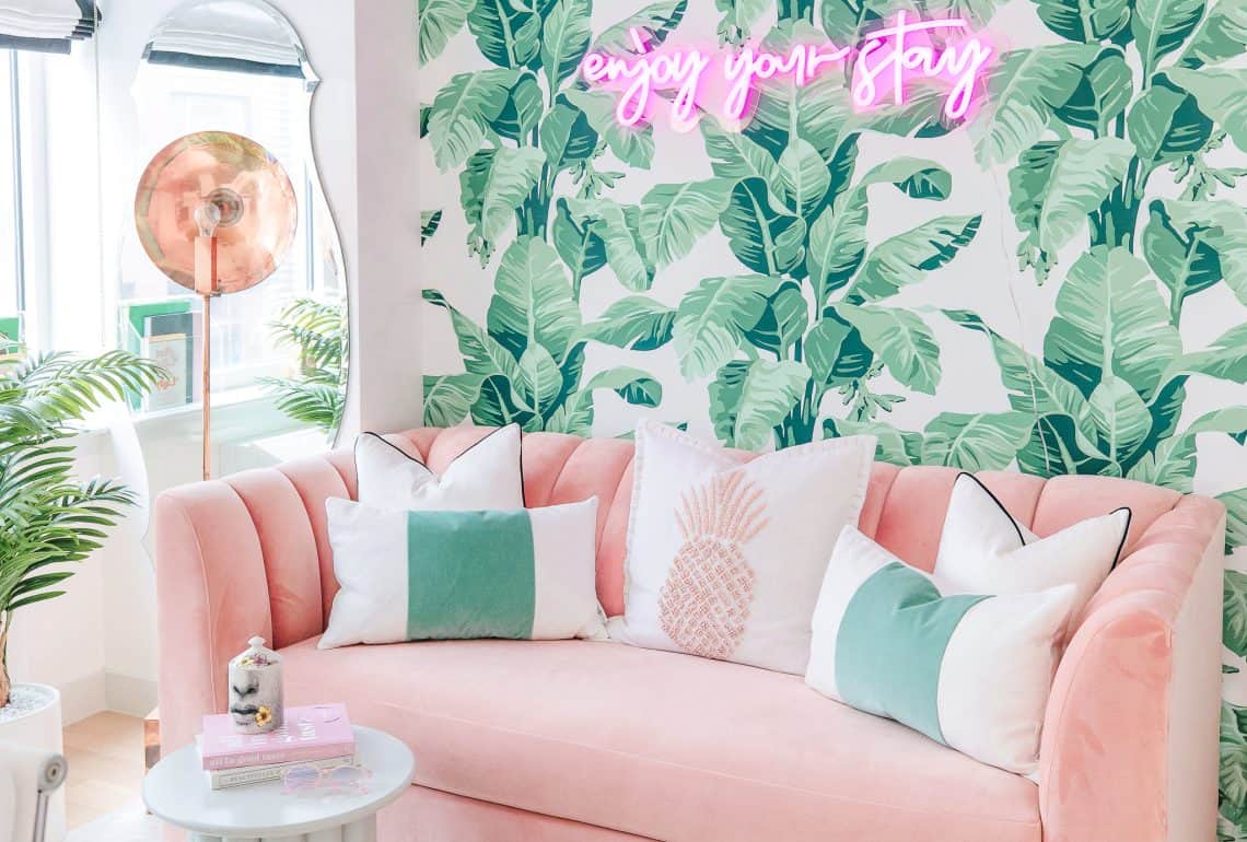 lindsay silberman blogger home office palm wallpaper neon sign pink couch