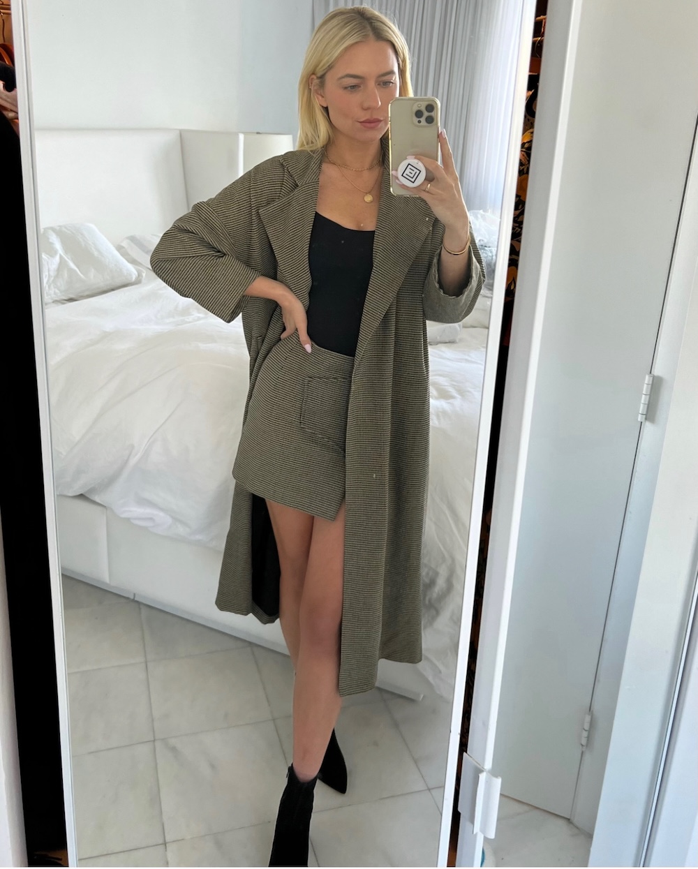 mini skirt and matching coat with a black bodysuit and black booties