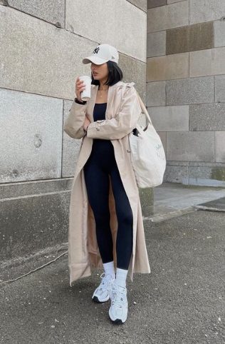rainy day outfit idea - athleisure with a rain coat and baseball hat