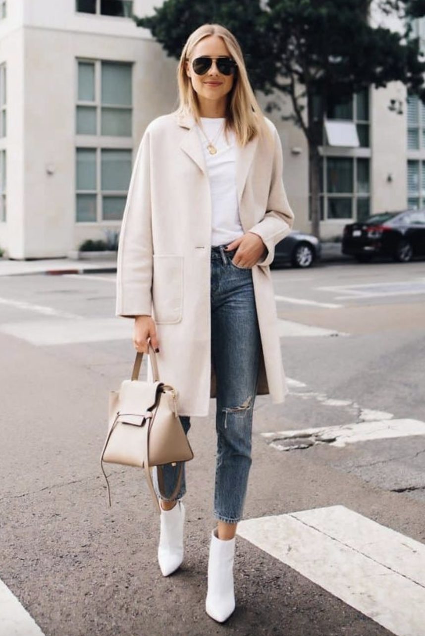 white boots with straight leg jeans, white t-shirt, and a beige coat