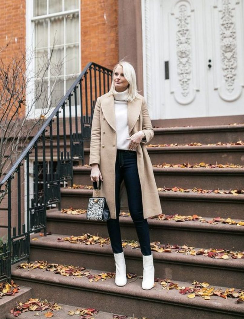 white boots outfit with black jeans and a white sweater