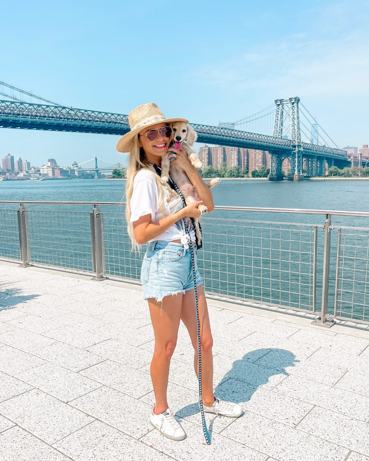 white sneaker outfit with denim shorts and a white tee
